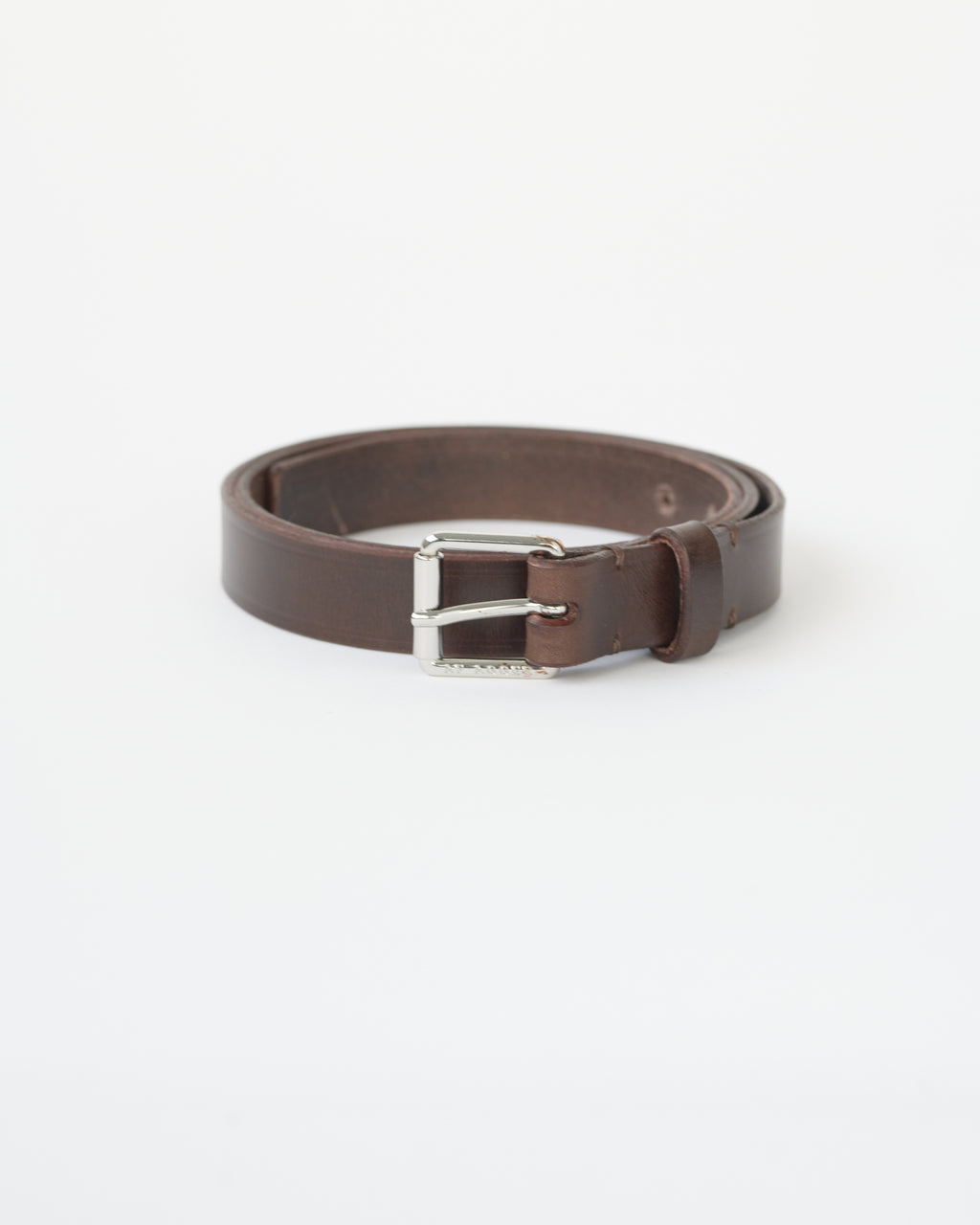 Brown leather belt with a silver buckle on a white background.