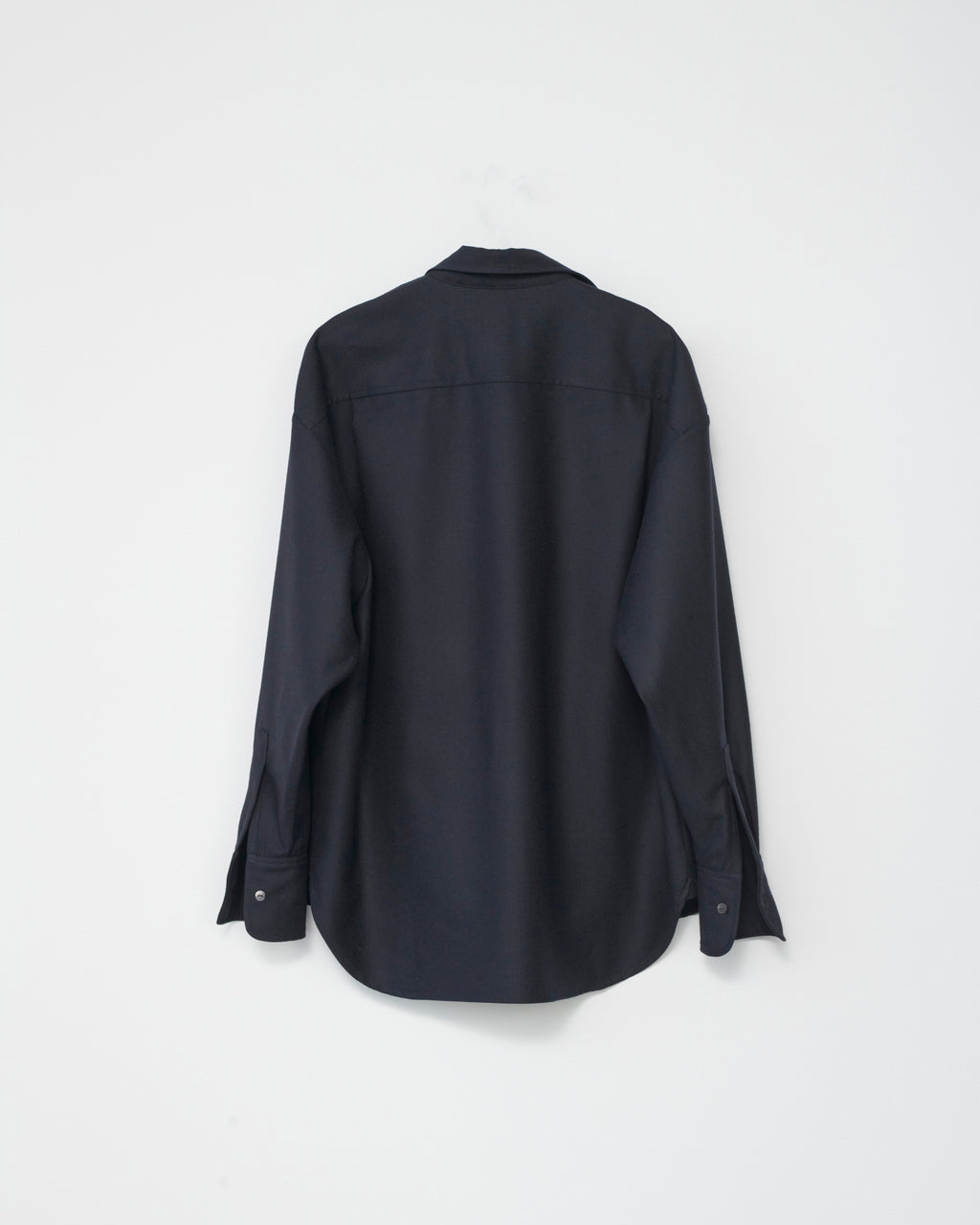 Navy wool shirt on a white background. Back side