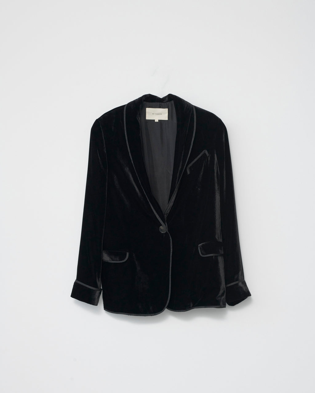 Black silk velvet blazer on a light gray background. Front view