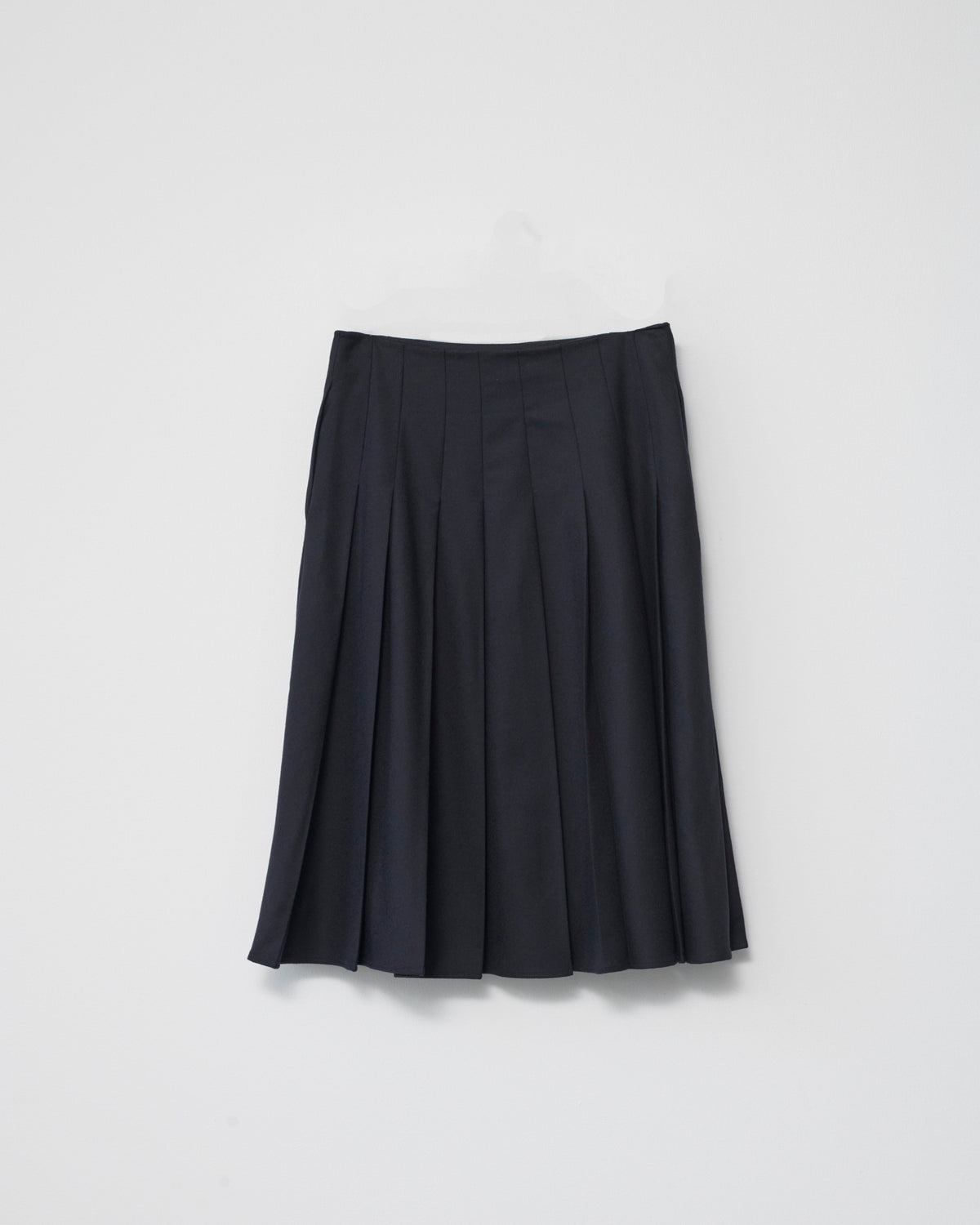 Navy skirt on a light gray background