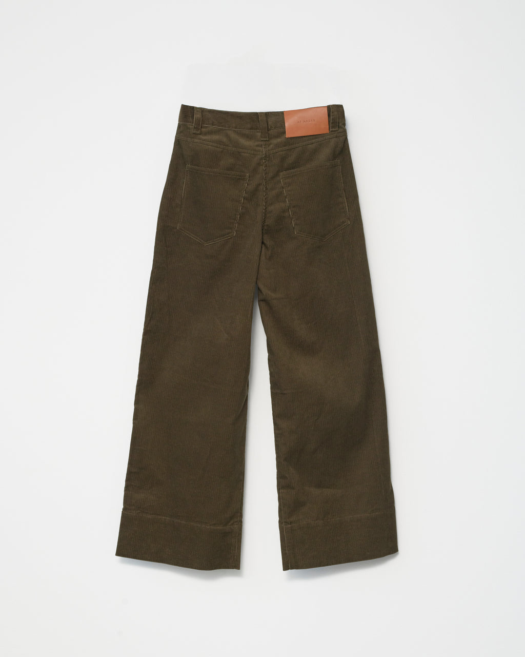 A pair of cognac-colored corduroy trousers against a white background back view.