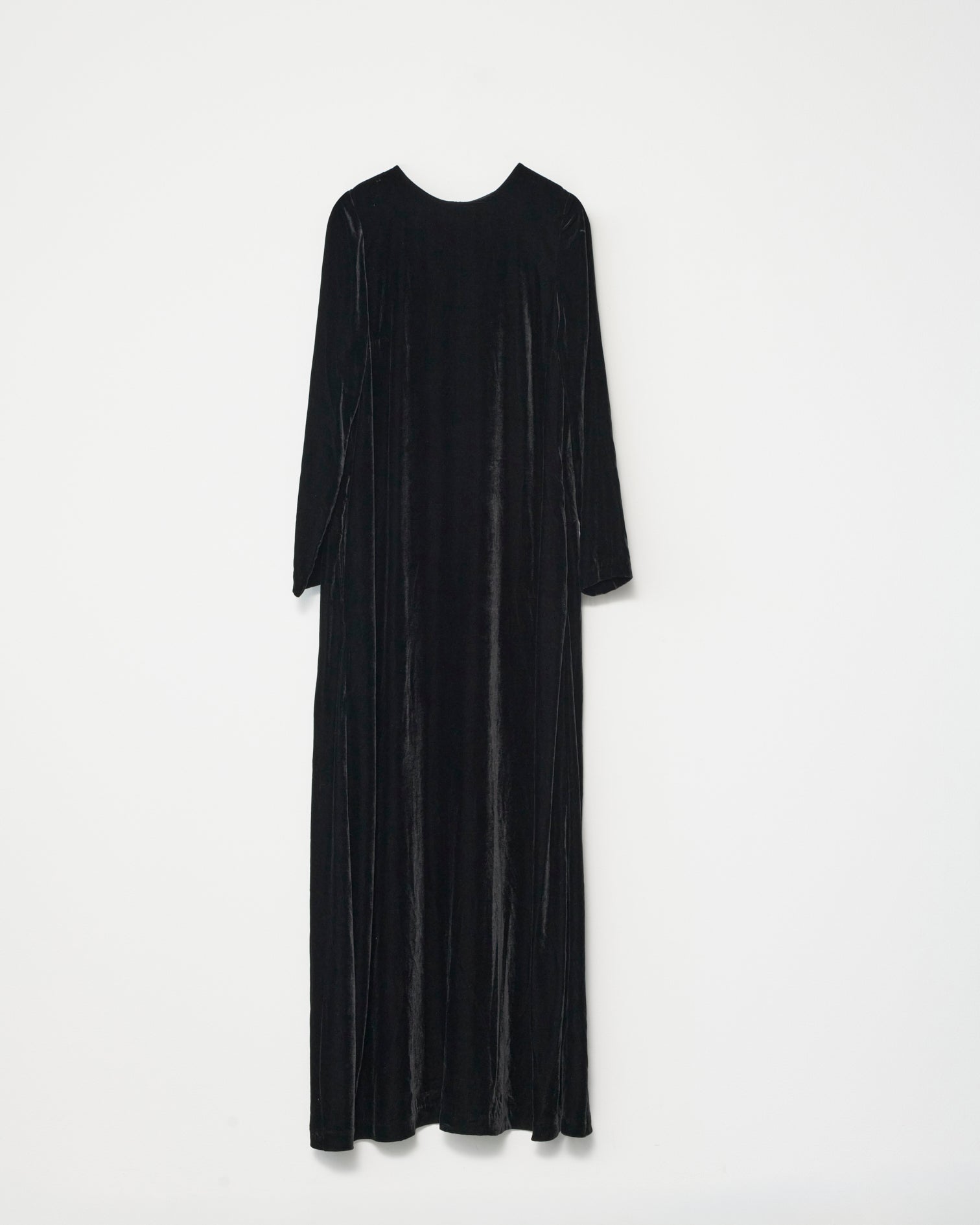 Black silk velvet dress on a white background. Front view