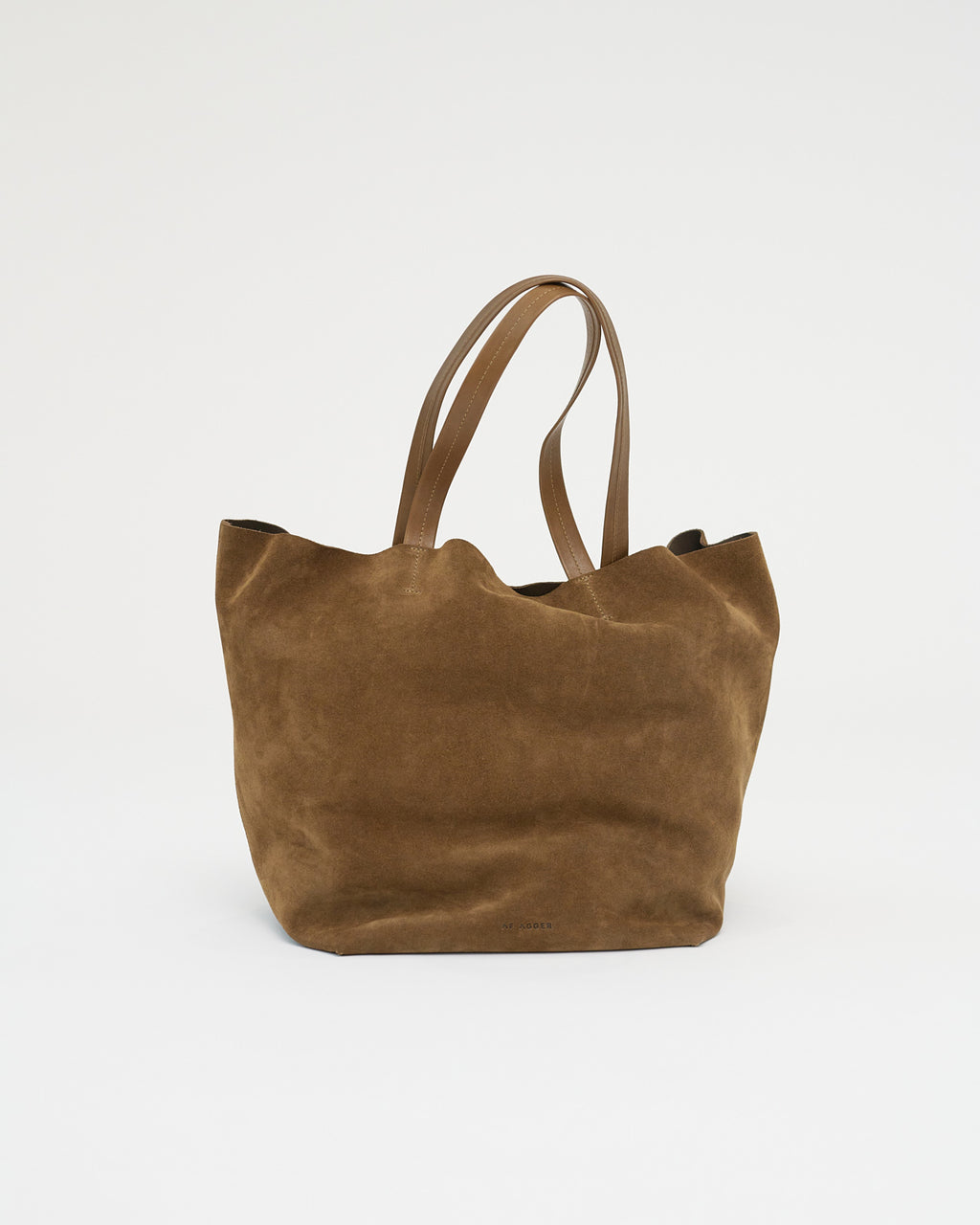 Brown suede tote bag on a white background . Front View