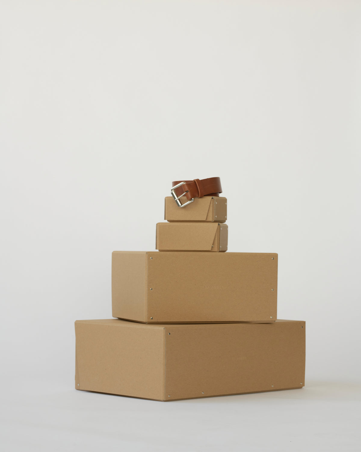 Boxes with brown leather belt