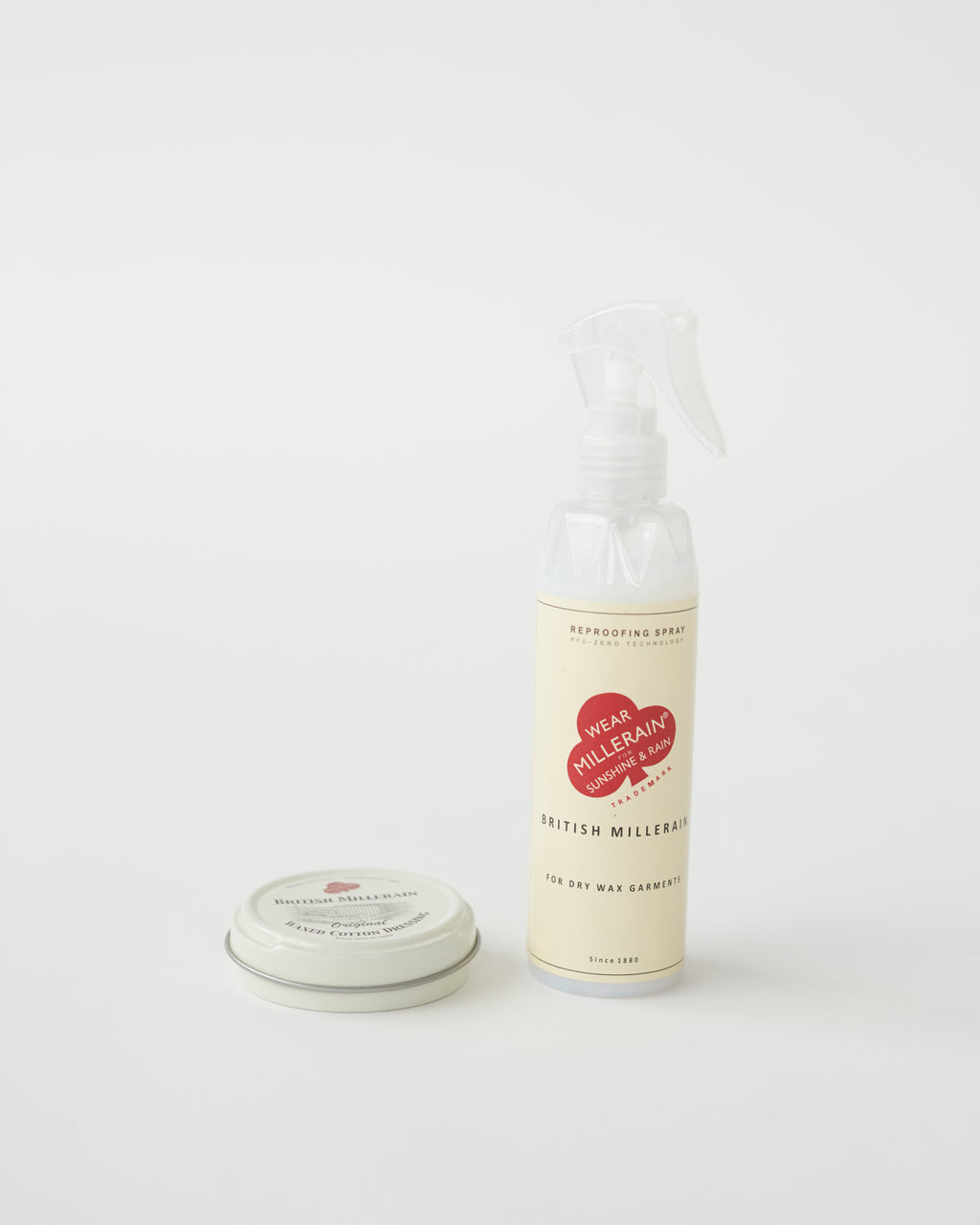 A tin container of British Millerain waxed cotton dressing with a label that includes the brand name and product details.