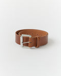 Wide cognac belt with a silver buckle on a white background